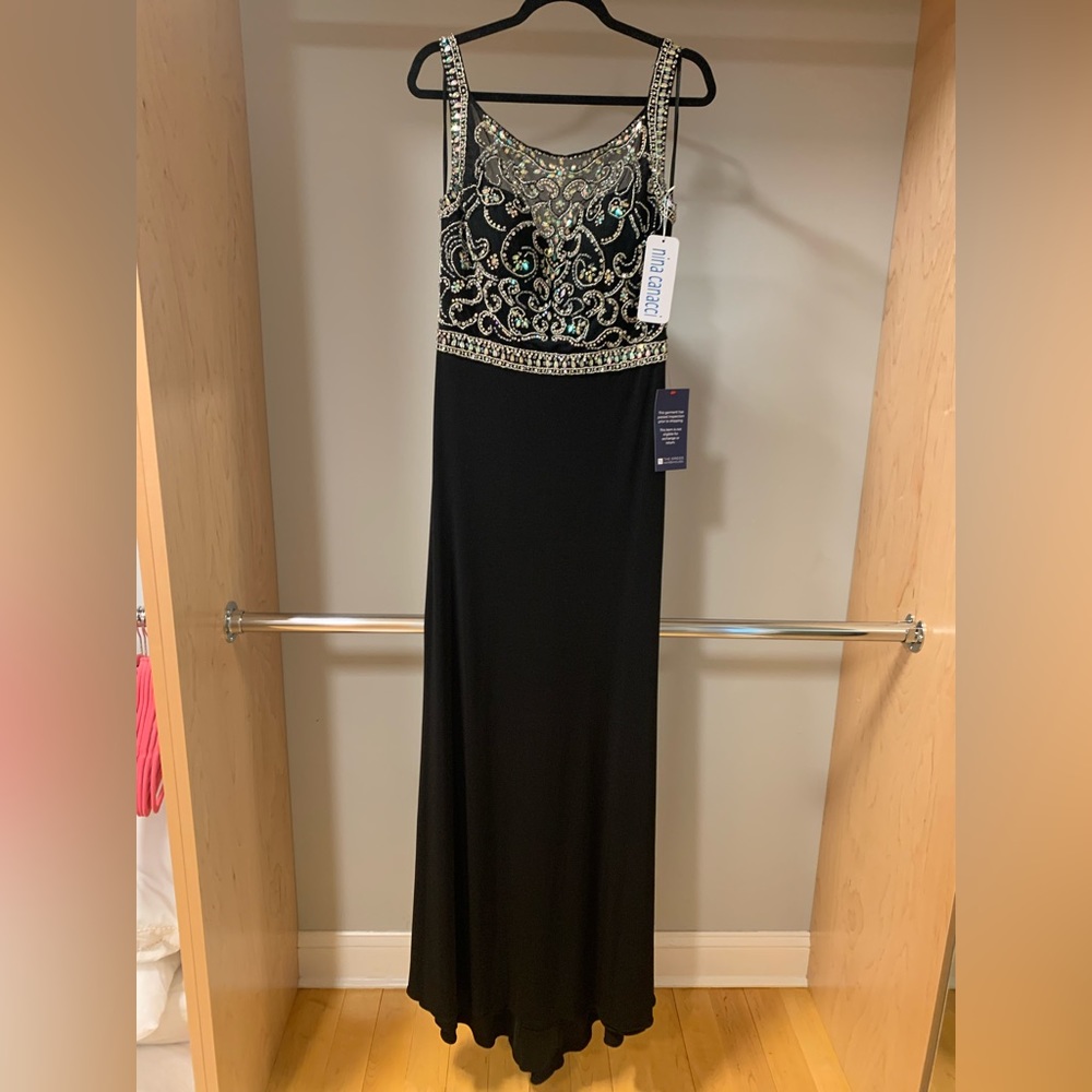 Brand New dress. Beautiful for prom, weddings. It’s sheer on the back top part.